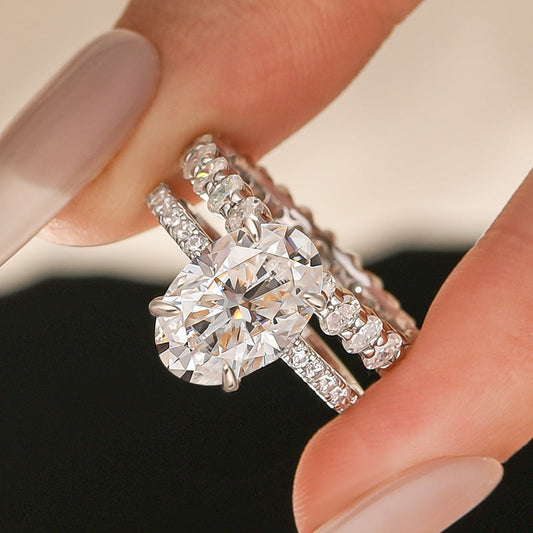 Aurevyn Moissanite 4.0Ct Hidden Halo Oval Cut White Gold Engagement Ring with 3.0Ct Oval Cut Wedding Band