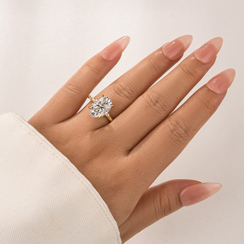 Aurevyn Yellow Gold 5.5 Ct Oval Cut Moissanite Engagement Ring In Sterling Silver