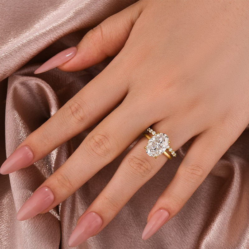 Aurevyn Solitaire 5.5Ct Oval Cut Yellow Gold Moissanite Wedding Ring Set With Round Cut Wedding Band