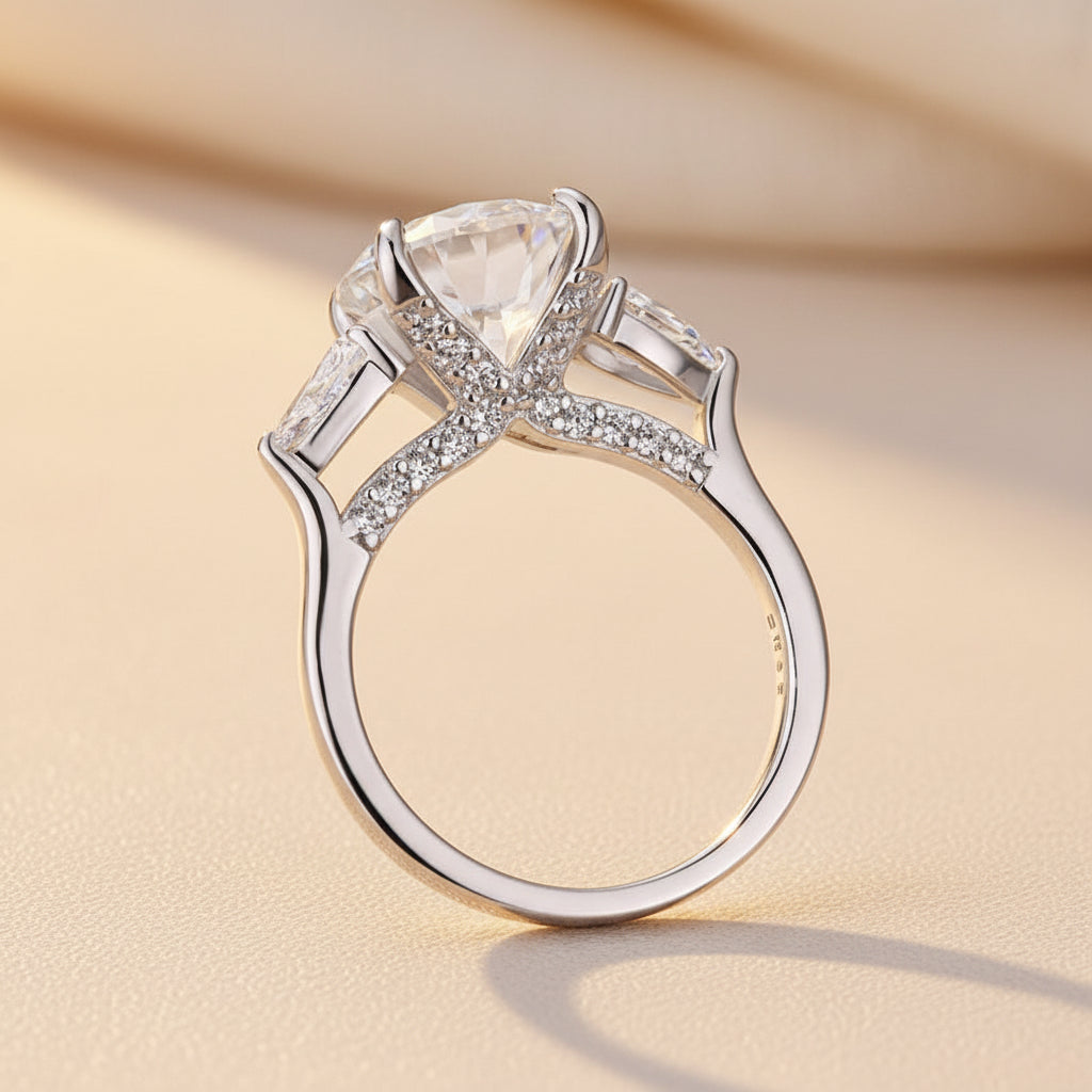 Aurevyn Moissanite 4.0 Ct Round Cut White Gold Engagement Ring with Pear Cut Side Stone