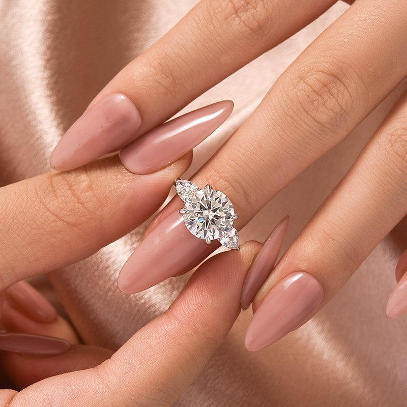 Aurevyn Moissanite 4.0 Ct Round Cut White Gold Engagement Ring with Pear Cut Side Stone