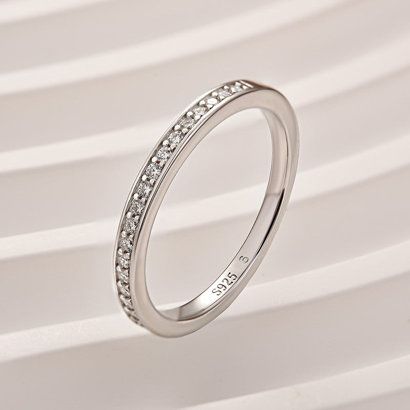 Aurevyn Channel Set Round Cut Wedding Ring In 925 Sterling Silver
