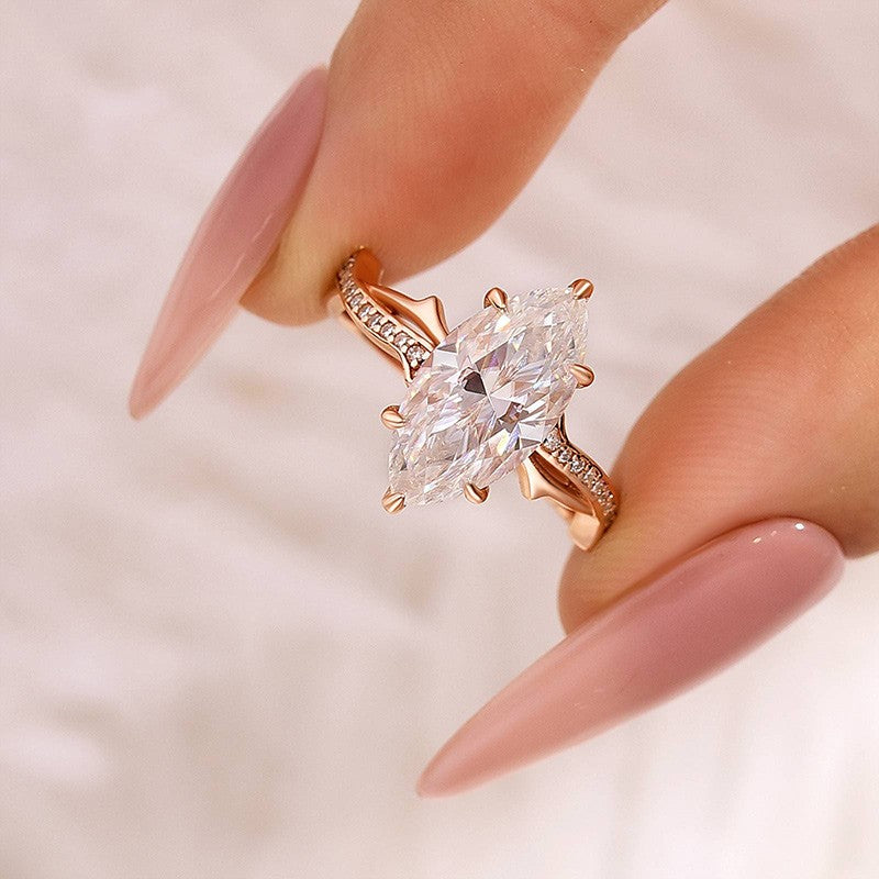 Aurevyn Moissanite 3.0Ct Marquise Cut Rose Gold Twist Engagement Ring In Sterling Silver