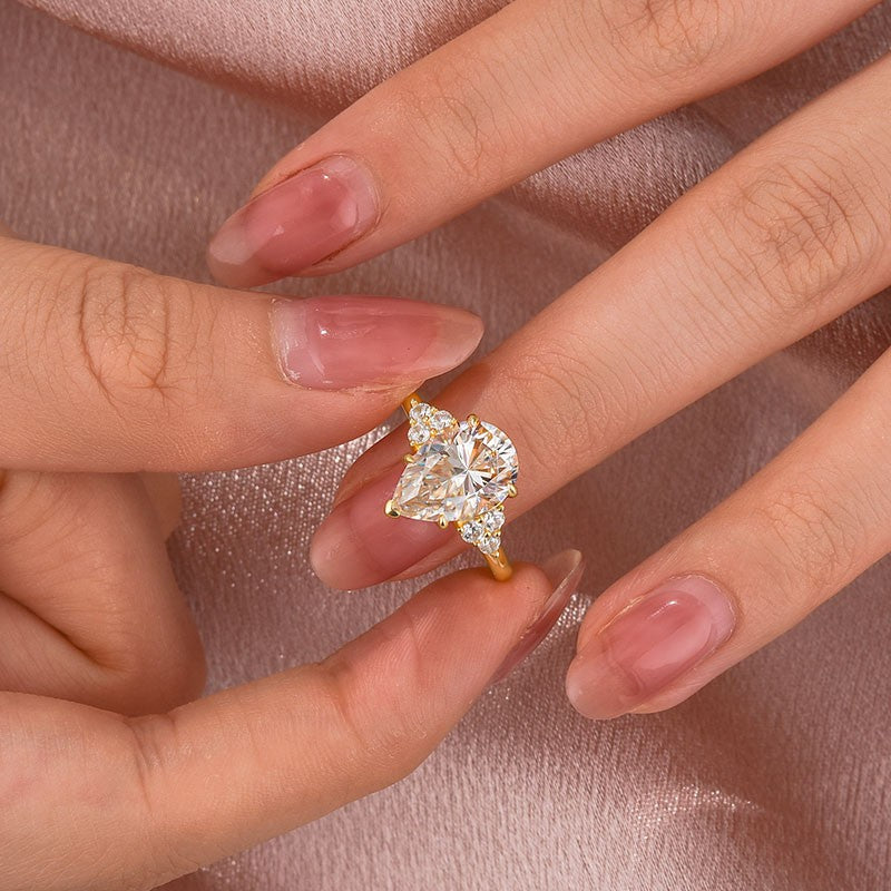 Aurevyn 3.0 Ct Pear Cut Yellow Gold Engagement Ring with Round Cut Side Stone