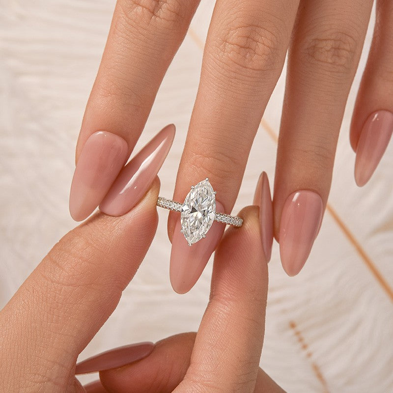 Aurevyn Moissanite 3.0Ct Marquise Cut Solitaire Engagement Ring with Pave Three-Sided Band in 18K White Gold Plated Sterling Silver