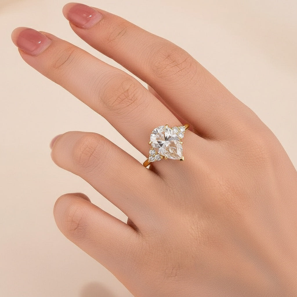 Aurevyn 3.0 Ct Pear Cut Yellow Gold Engagement Ring with Round Cut Side Stone