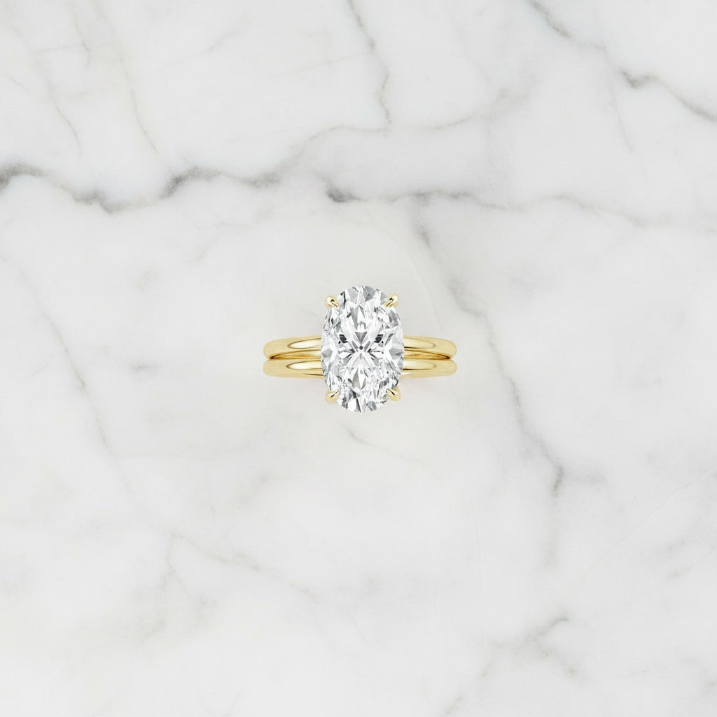 Aurevyn 4.0Ct Solitaire Oval Cut Yellow Gold Engagement Ring with Plain Wedding Band