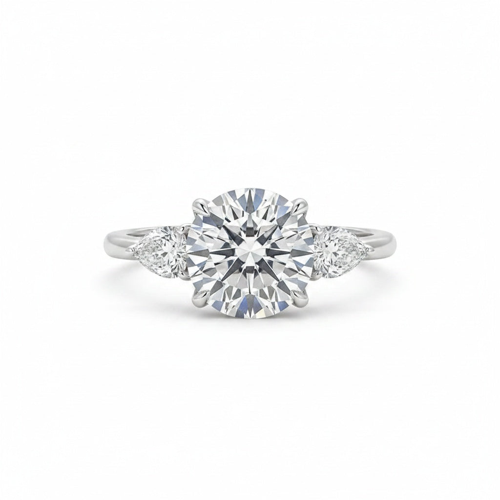 Aurevyn Moissanite 4.0 Ct Round Cut White Gold Engagement Ring with Pear Cut Side Stone