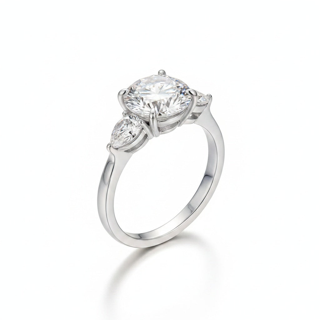 Aurevyn Moissanite 4.0 Ct Round Cut White Gold Engagement Ring with Pear Cut Side Stone