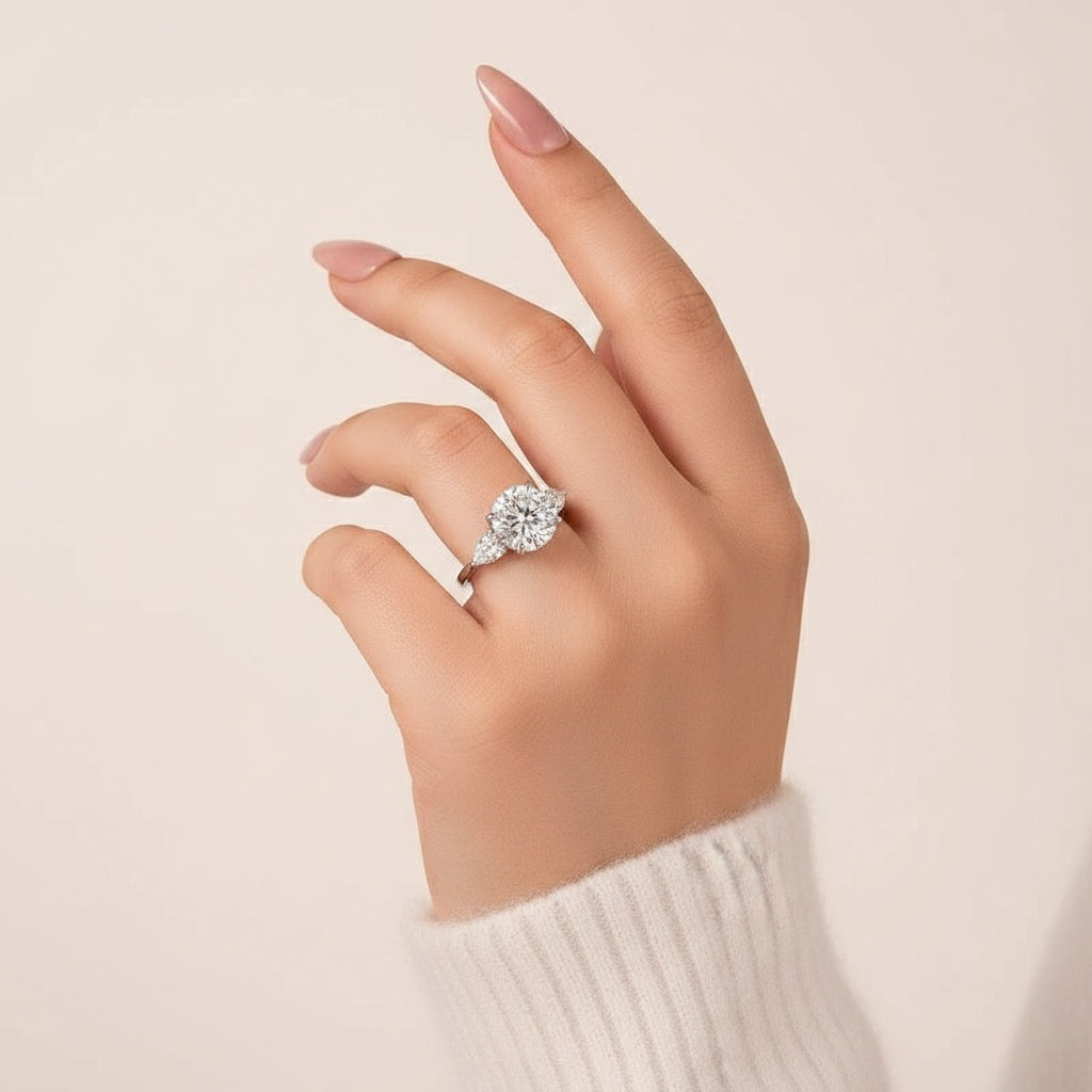 Aurevyn Moissanite 4.0 Ct Round Cut White Gold Engagement Ring with Pear Cut Side Stone